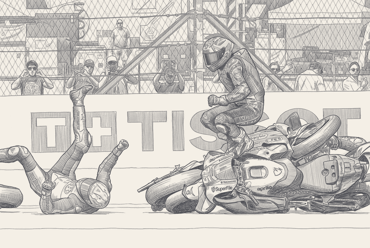 Two factory-liveried MotoGP bikes in matching colours sliding through a gravel trap at the first corner, dust rising, a third bike upright and away in the background.