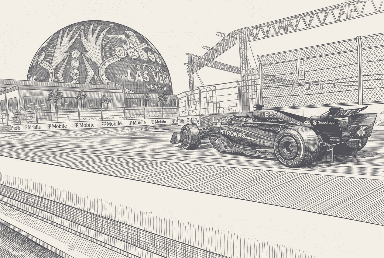 Night scene on the Las Vegas Strip with a 2026-generation Formula 1 car blurred at speed in the foreground, the Sphere glowing behind it, and the city's tower lights reflected along the car's silver bodywork.