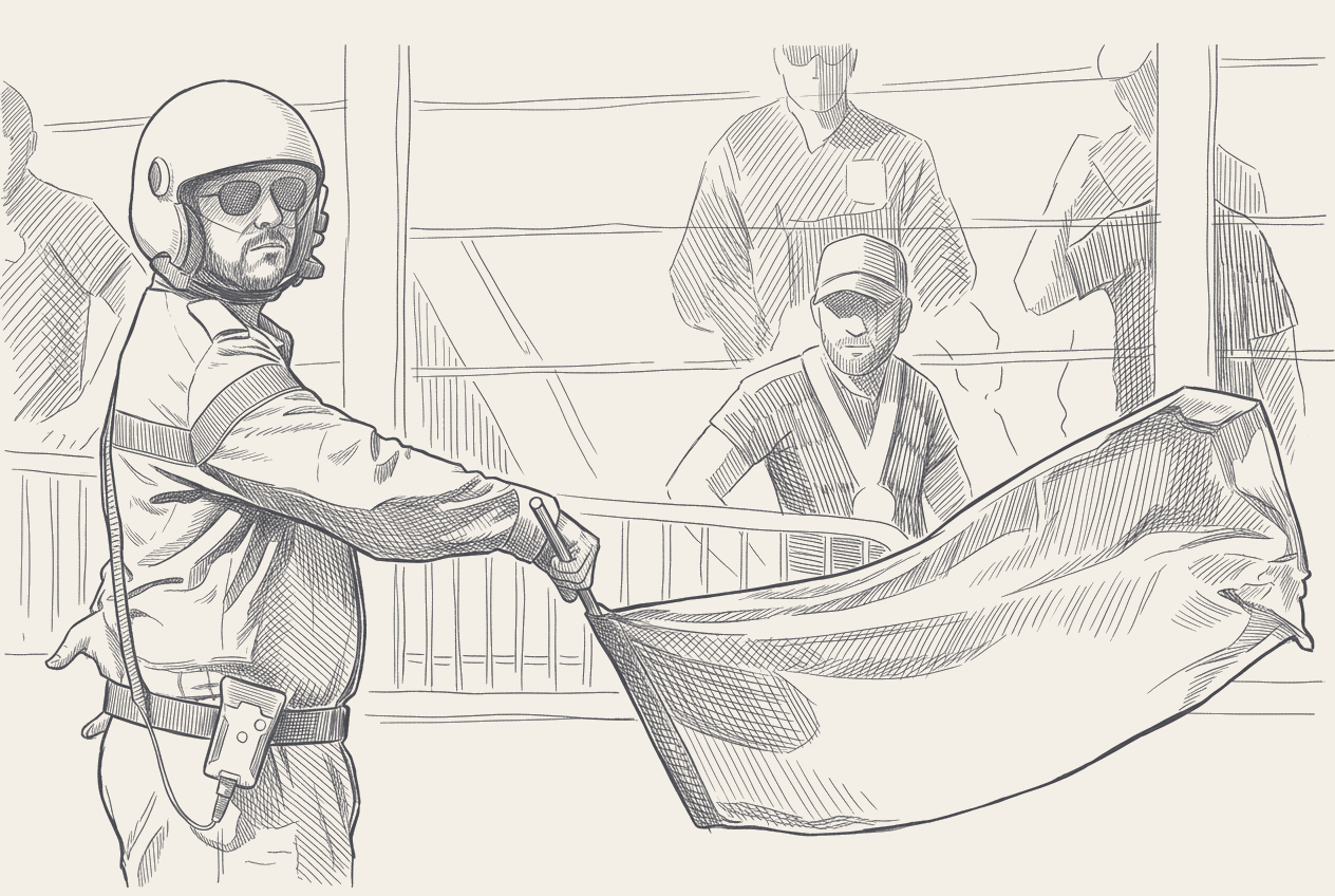 Two-tone hatched illustration of an empty MotoGP front-row grid box with two motorcycles on paddock stands, a marshal post with a furled red flag in the middle distance, and an inset of the Safety Commission agenda sheet.